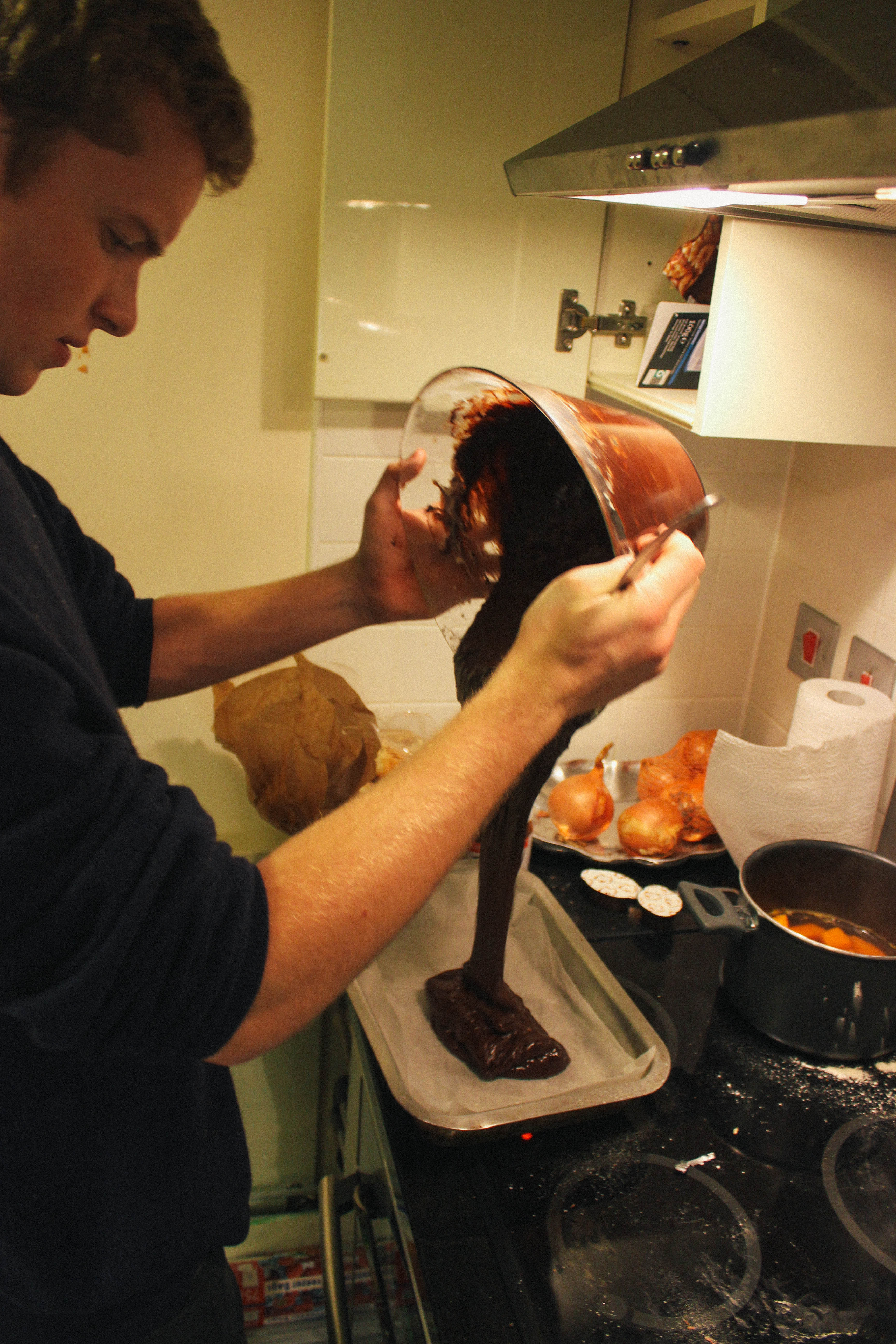 Pouring brownie mix - dessert