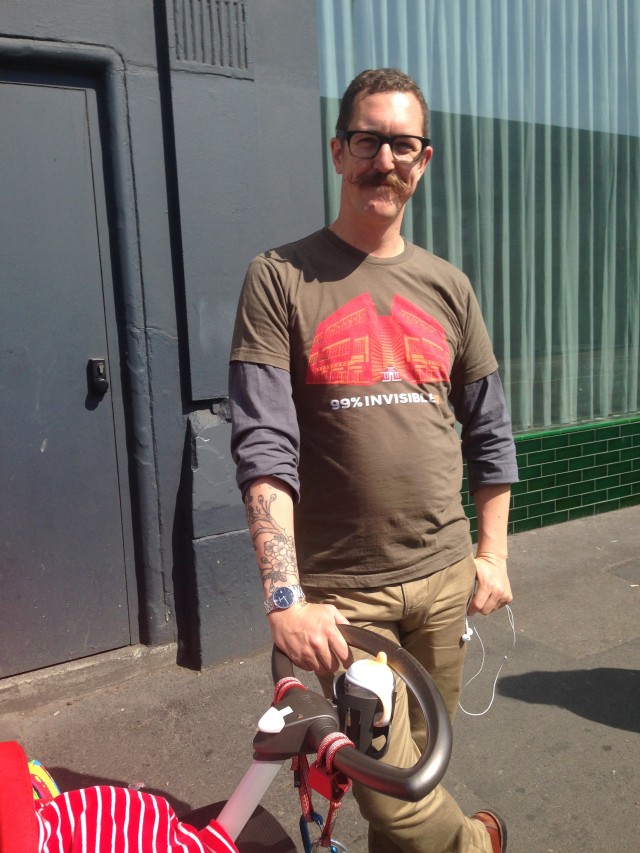 With his moustache and a baby, he's doing well for himself