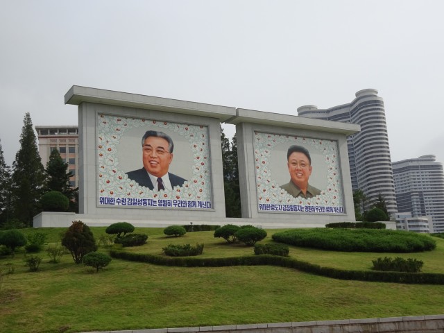 Mosaics of the supreme leaders surrounded by Kimilsungias