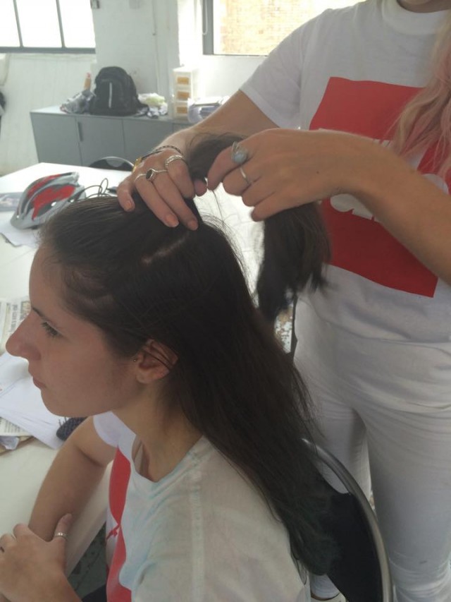 Take the top layer of hair, twist and secure into a bun
