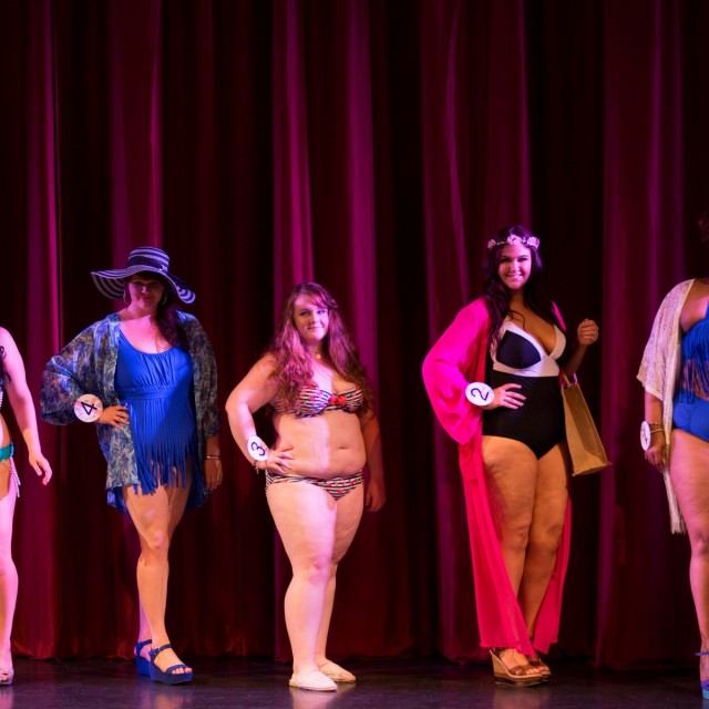 Competitors take part in the swimwear round at the Miss British Beauty Curve 2015 pageant at the Epsom Playhouse in Epsom, Surrey. These buxom beauties prove that big really is beautiful as they strut their stuff at the Miss British Beauty Curve 2015 competition. See swns story SWCURVE. The pageant for plus-size women saw 27 contestants - ranging from a size 14 to a 26 - flaunt their figures onstage on Saturday evening at Epsom Playhouse, Surrey. After battling fashion-wear, swimsuit and evening gown rounds, it was Miss Preston Curve Rebecca Argent, 19, who walked away with the under-30 ÃMissà title last night, beating the 18 other women in this category. The gorgeous teen, whoÃs a size 18 and works in retail, said: ÃThis is the best day of my life à I canÃt stop crying! ÃIÃve always felt discriminated against and nervous because of being a bigger girl. I used to be the shy quiet girl who was bullied because sheÃs fat. ÃDoing this has changed me completely ÃIÃd never have stood up on a stage in swimwear or spoken in front of a crowd before entering. ÃThe best part about winning is being a positive role models to girls who were bullied in school like I was Ãto show them they donÃt have to be a size zero to be beautiful. They can be curvacious and still come away with a big sparkly crown. The winner of the ÃMsà title à for women aged 30 plus à was 31 year old Ms Surrey Curve Katherine Henry, who beat eight contestants to win first place.