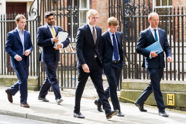 Patrick Foster ( left), Thady Duff (3rd from the left) and Leo Mahon (Second from right) Other men with folders are legal advisors arrive at Gloucester Crown Court, Gloucestershire. 06 August 2015. Four farming students appeared in court accused of raping a female student at the summer ball of a prestigious agricultural university. See swns story SWRAPE. James Martin, 19, Patrick Foster, 21, Thady Duff, 22, and Leo Mahon, 20 were students at the Royal Agricultural University in Cirencester, Glos. on May 24 this year, when the alleged incident took place. The public gallery at Gloucester Crown Court was packed with friends and family of the young men, who spoke only to confirm their names. A further hearing has been scheduled for December 18, when the original charges are expected to be changed. Patrick Foster, from Colchester, Essex and Martin, of Chipping Norton, Oxfordshire, had originally each been charged with two offences of rape and one of assault by penetration. Duff, of Blunsdon, Swindon and Mahon, of Cirencester, Glos., were facing four offences of rape and one of assault by penetration. Duff had also been charged with one count of sexual assault and possession of extreme pornographic films. All four men have been released on bail to appear in court on December 18.