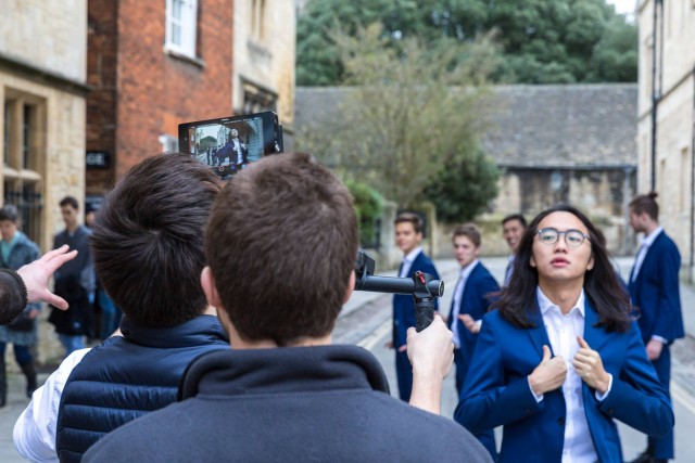 Out of the Blue, a group of posh toffs from Oxford University have released the most cringeworthy Christmas single of all time - an all-male choir rendition of 'Santa Baby.' See SWNS story SWCRINGE. Out of the Blue, a 12-piece a cappella group, shot a cheesy video for the festive hit which captured them in action all over famous Oxford landmarks - serenading each other. The lyrical lads donned blue suits and Santa hats for the quirky rendition of Eartha Kitts much-loved classic and combined tight harmonies with outrageous choreography. Last year, they racked up over SIX MILLION views with a cover of ShakiraÃs ÃHips donÃt lieà which made a whopping Ã10,000 for a childrenÃs hospice. Helen and Douglas House, in Oxford, was the first hospice for children in the world, and running purely on donations, has benefitted hugely from the groupÃs fundraising efforts.