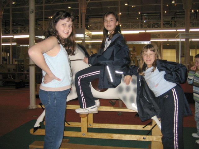 Rocking the middle child on a rocking horse
