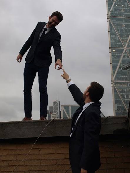 A tall looking down at a small, while a small looks up at a tall
