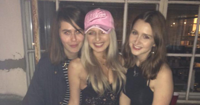 girls wearing ball caps